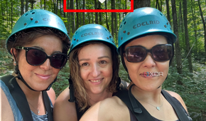 A photo from an iPhone library showing three women smiling wearing headgear, the add sticker pop-up selected.