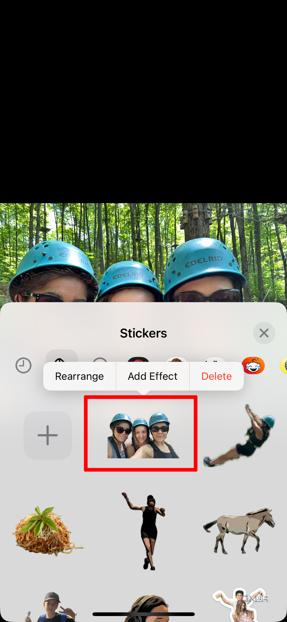 An iPhone photo in the background with the Sticker drawer open showing the same photo now turned into a sticker, among others.