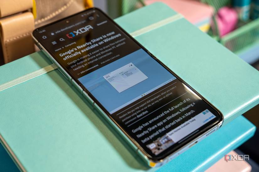 A Samsung Galaxy Z Flip 5 open showing an article on the XDA website mobile mode.