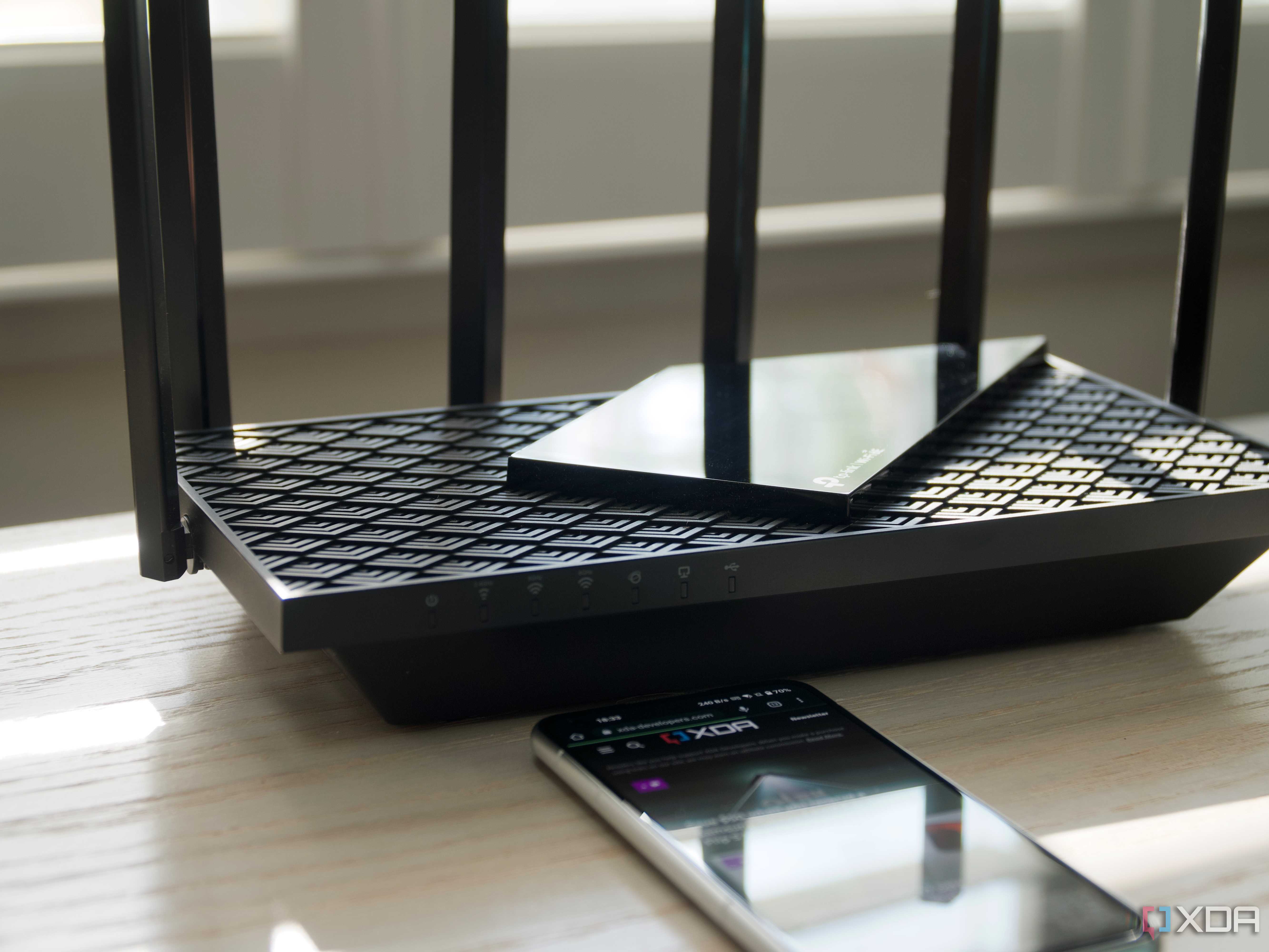 TP-Link Archer AXE75 tri-band on a bench