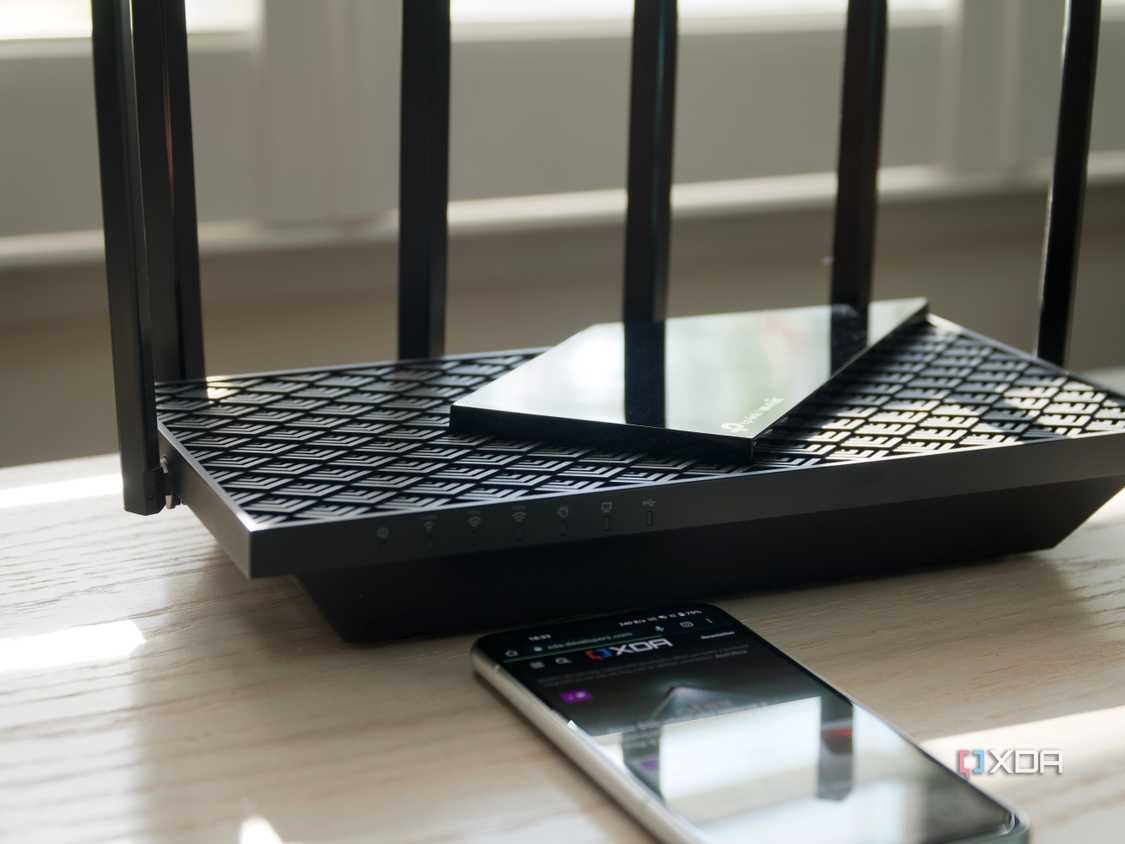 TP-Link Archer AXE75 tri-band on a bench