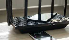 TP-Link Archer AXE75 tri-band on a bench
