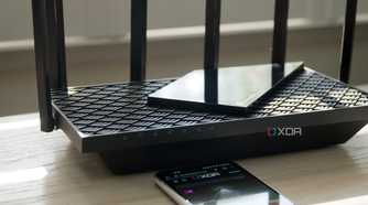 TP-Link Archer AXE75 tri-band on a bench