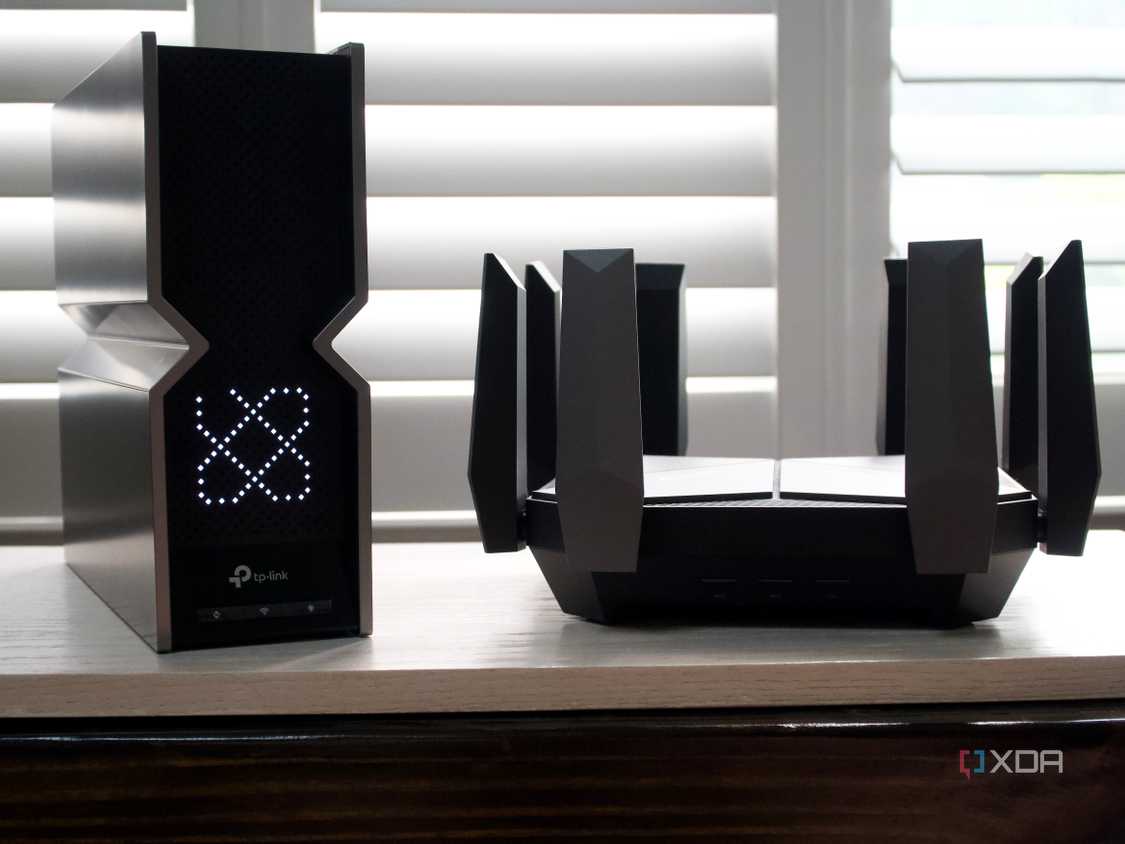 TP-Link Archer BE800 Wi-Fi 7 next to an Archer AXE300