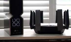 TP-Link Archer BE800 Wi-Fi 7 next to an Archer AXE300