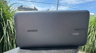 UGreen's 145W Power Bank resting on a chair.