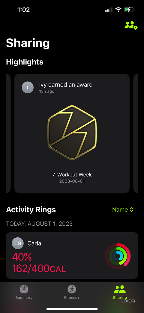 Highlights showing someone earned an award in the Apple Fitness app