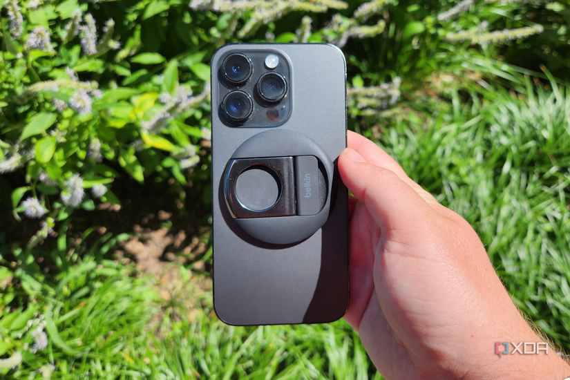 Belkin's iPhone Camera Mount connected to an iPhone in-hand.