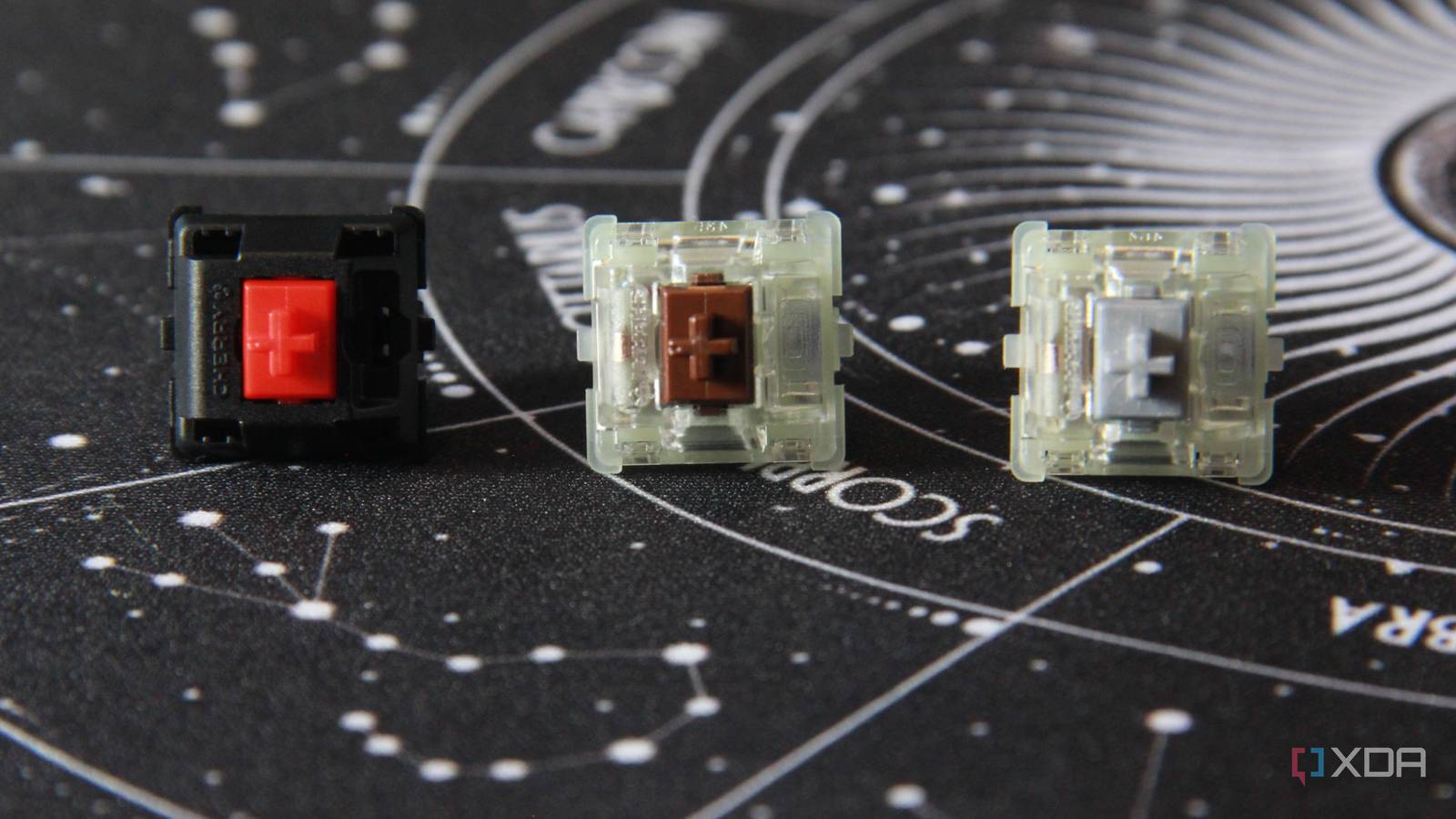 The Cherry MX2A red, brown, and silver switches on a mat