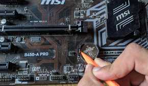 An image of a CMOS battery inside an MSI B450-A Pro motherboard