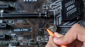 An image of a CMOS battery inside an MSI B450-A Pro motherboard