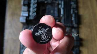 An image of a CMOS battery with the MSI B450 A-Pro motherboard in the background