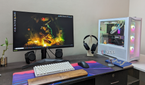 Desktop PC setup showing a gaming PC, monitor, keyboard, mouse, and headset