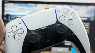 An image showing the DualSense controller with a gaming monitor in the background.