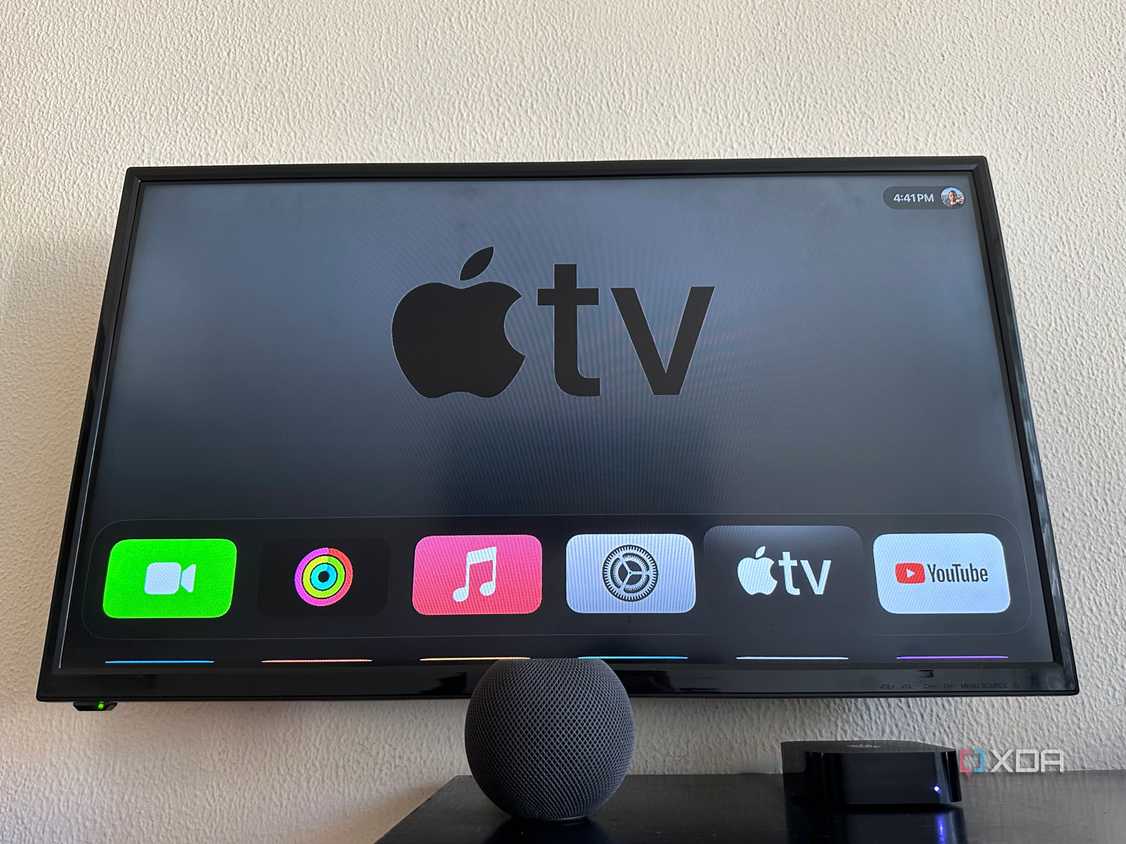 Apple TV 4K 3 next to HomePod Mini on a table with Apple TV displayed on the screen