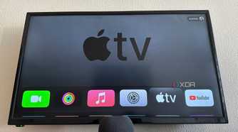 Apple TV 4K 3 next to HomePod Mini on a table with Apple TV displayed on the screen