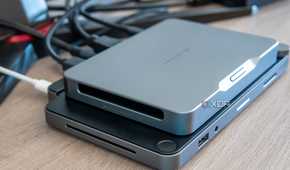 Left-side angled view of the Khadas Mind mounted on the Mind Dock, showing the speaker grill on the latter