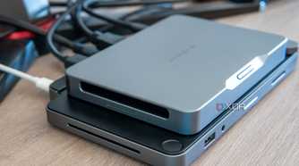 Left-side angled view of the Khadas Mind mounted on the Mind Dock, showing the speaker grill on the latter