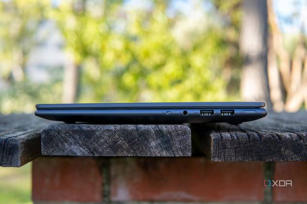 Right-side view of the Lenovo Slim Pro 9i 14-inch version with two USB Type-A ports, a headphone jack, a power button, and a webcam kill switch
