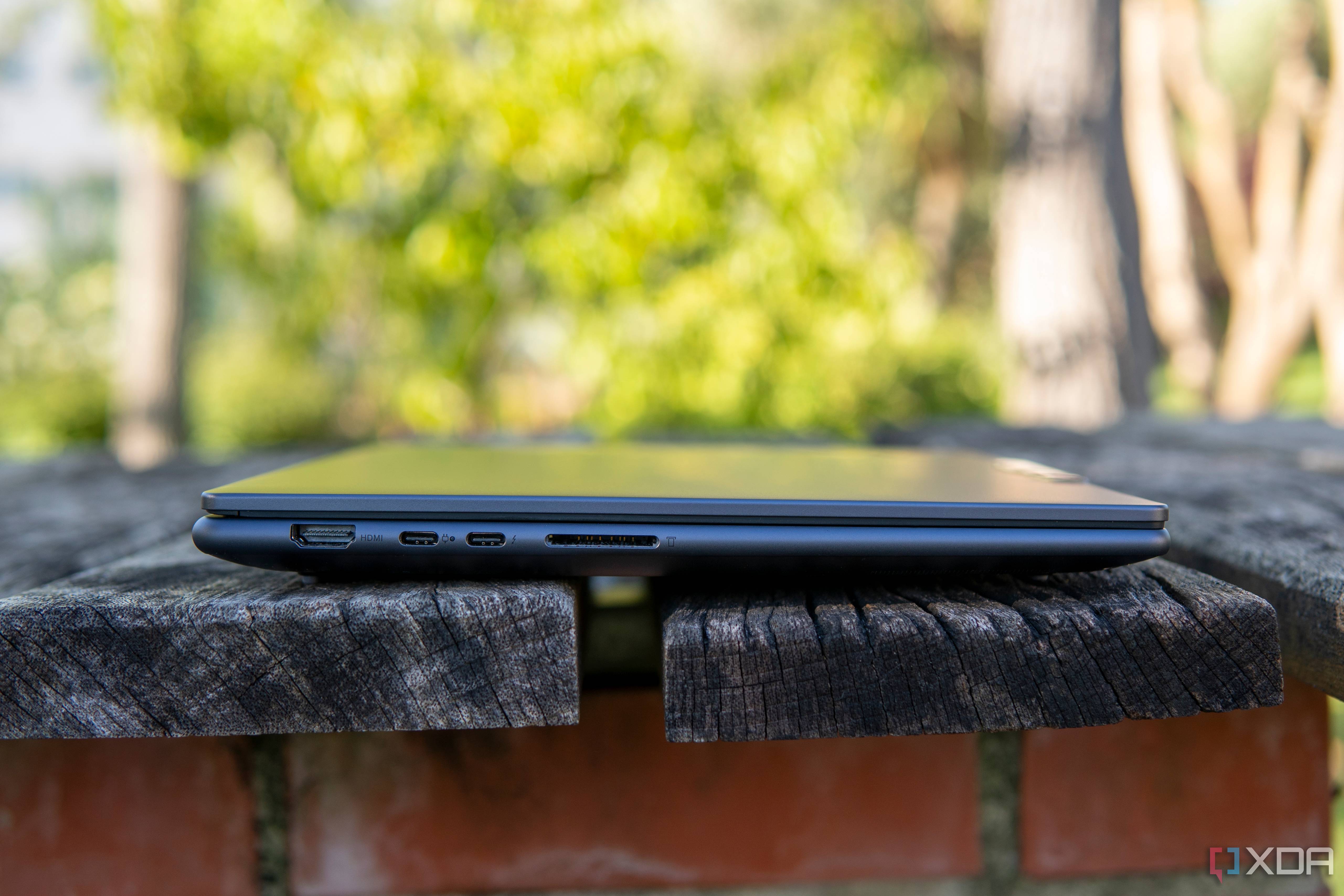 Left-side view of the Lenovo Slim Pro 9i 14-inch model with an HDMI port, two USB Type-C ports, and an SD card reader