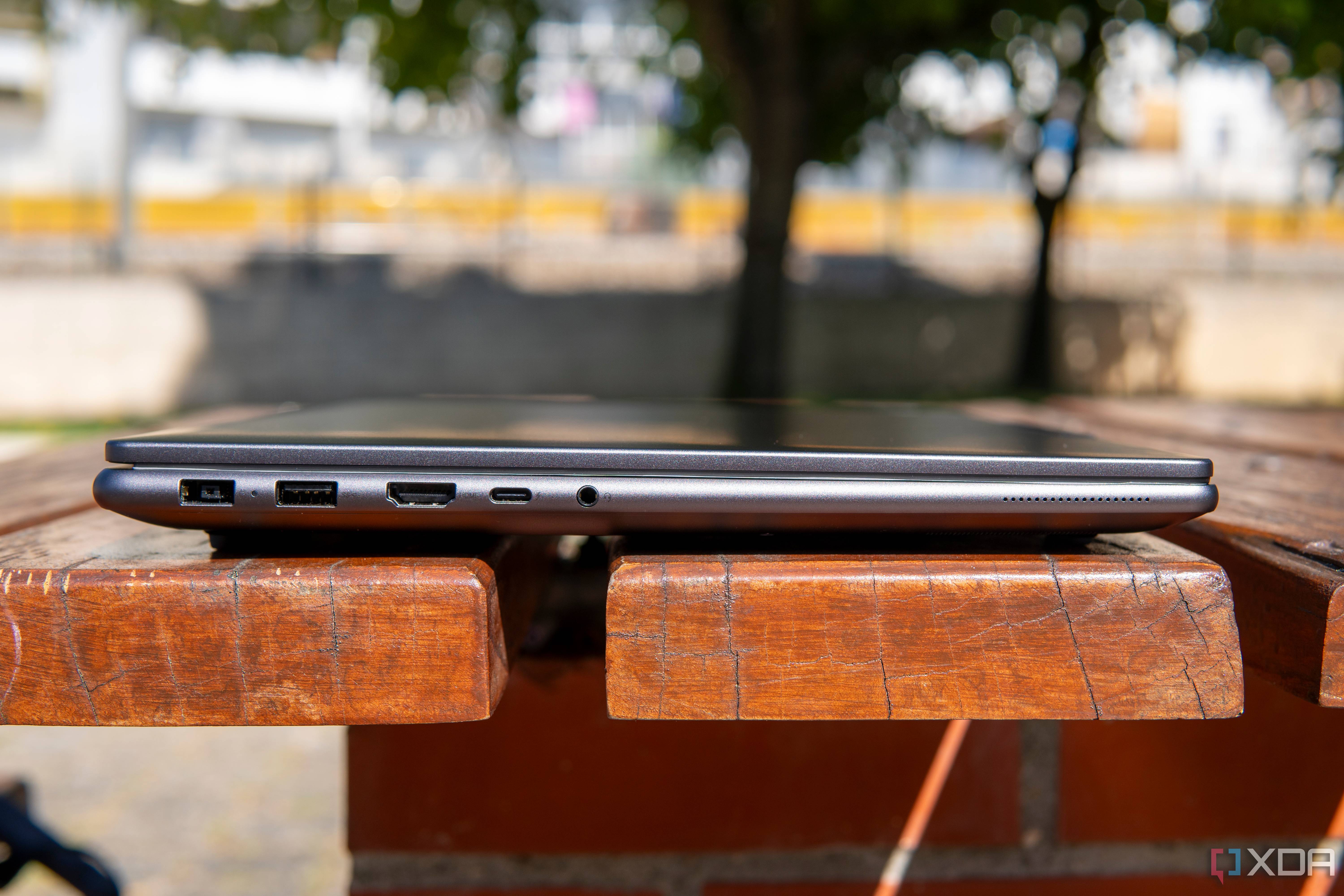 Left-side view of the Lenovo Slim Pro 9i 16-inch model with a power adapter port, a USB Type-A port, HDMI, Thunderbolt 4, and a headphone jack