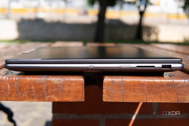 Right-side view of the Lenovo Slim Pro 9i 16-inch model with a USB Type-A port, SD card reader, power button, and a webcam kill switch