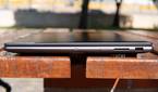 Right-side view of the Lenovo Slim Pro 9i 16-inch model with a USB Type-A port, SD card reader, power button, and a webcam kill switch
