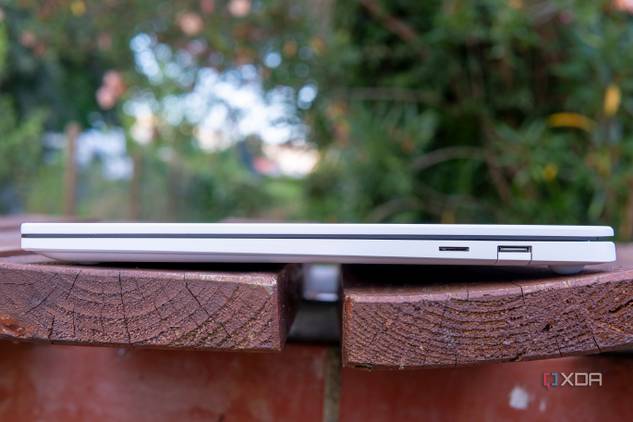 Right-side view of the LG Gram Style with the lid closed showing a collpasible USB Type-A port and a microSD card slot