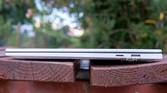 Right-side view of the LG Gram Style with the lid closed showing a collpasible USB Type-A port and a microSD card slot