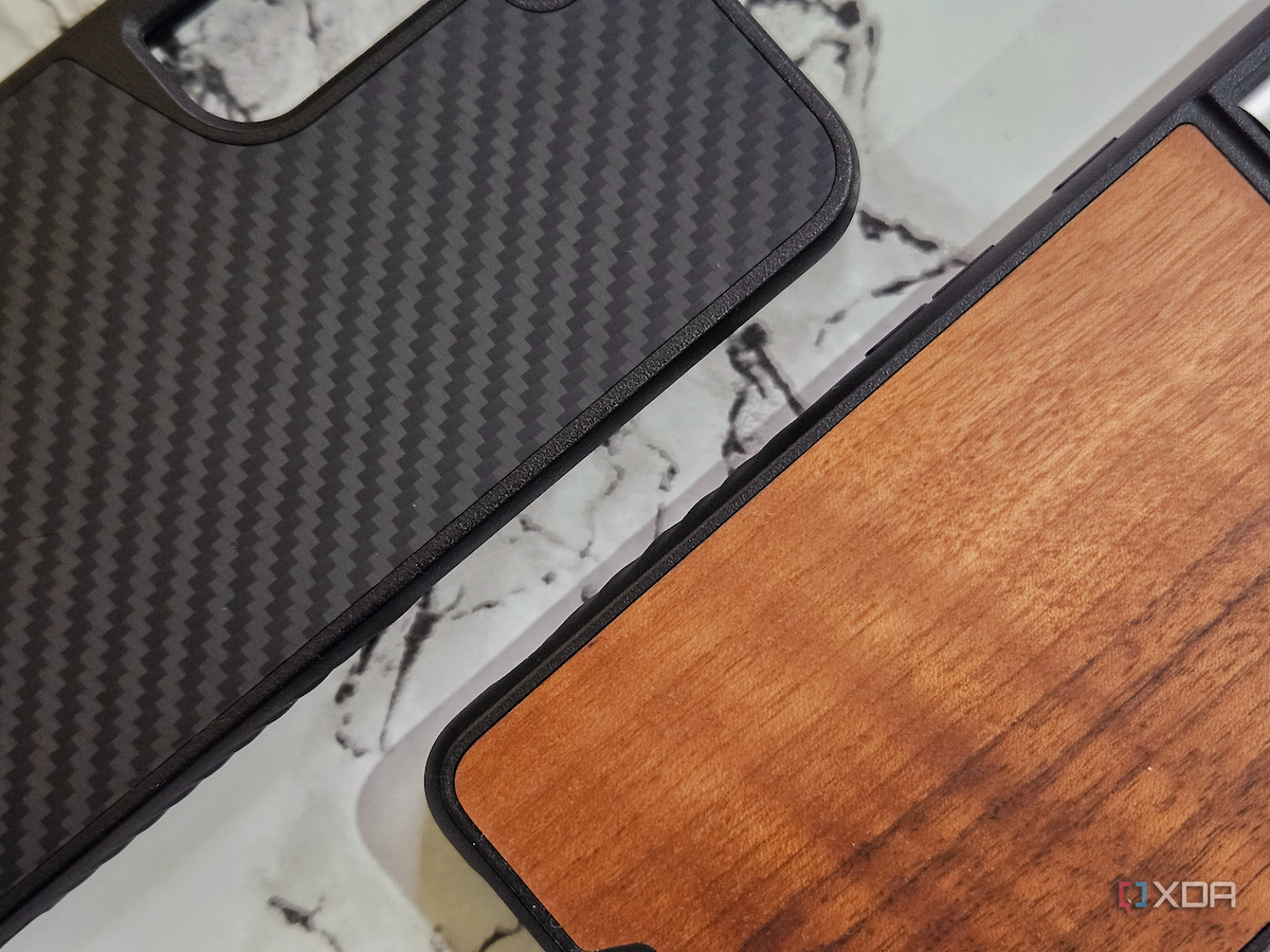 An image showing two Mous Limitless 5.0 case, one with Walnut and the other with Aramid finish on the back.