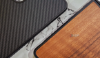 An image showing two Mous Limitless 5.0 case, one with Walnut and the other with Aramid finish on the back.