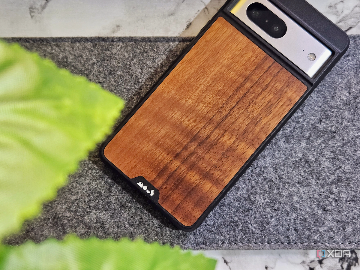 A image showing the Mous Limitless 5.0 case with Walnut back finish kept on a felt keyboard mat.