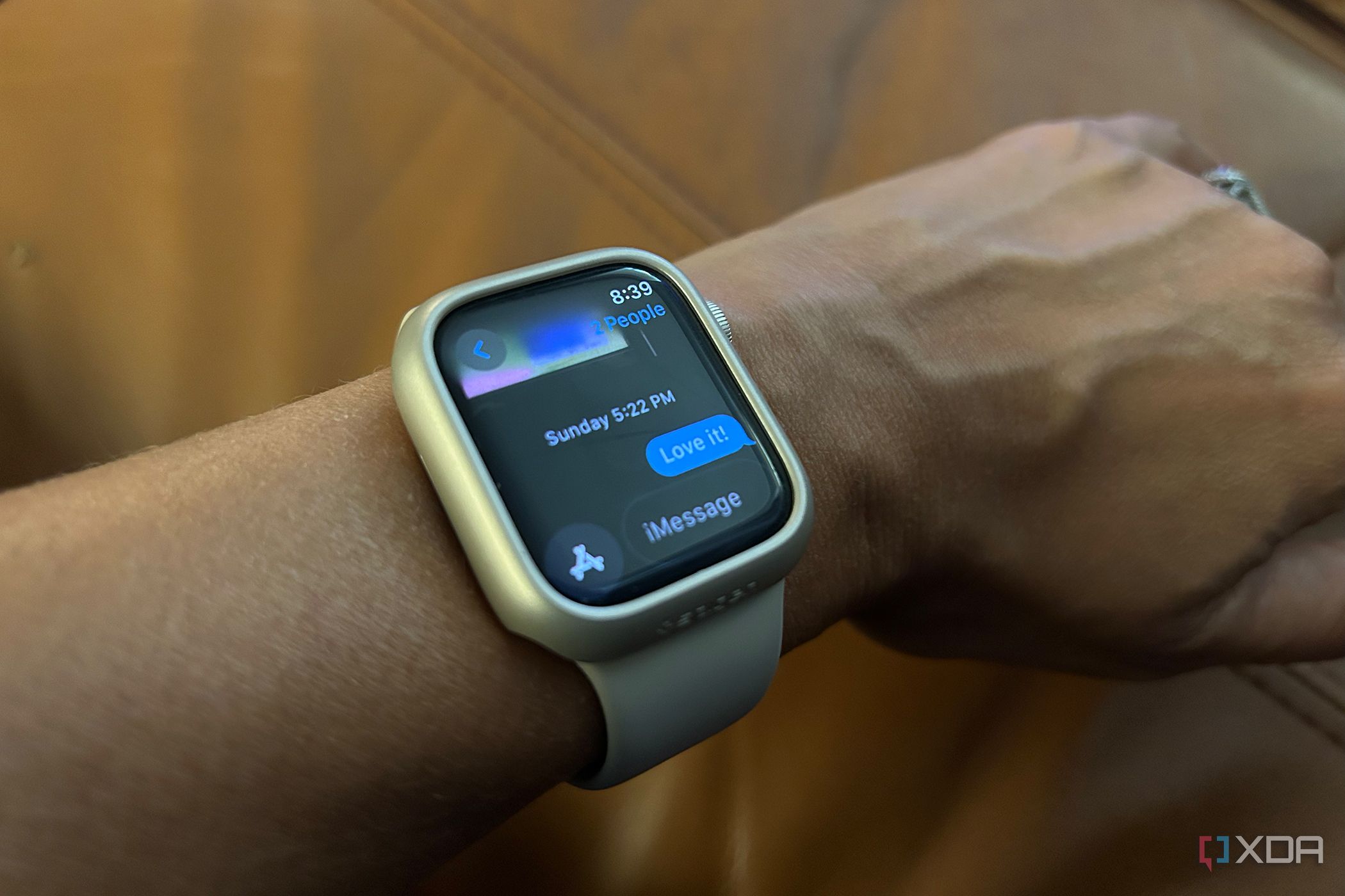 worn Apple Watch showing a reply to an iMessage "Love it!"