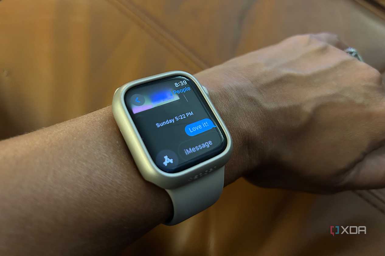 worn Apple Watch showing a reply to an iMessage "Love it!"