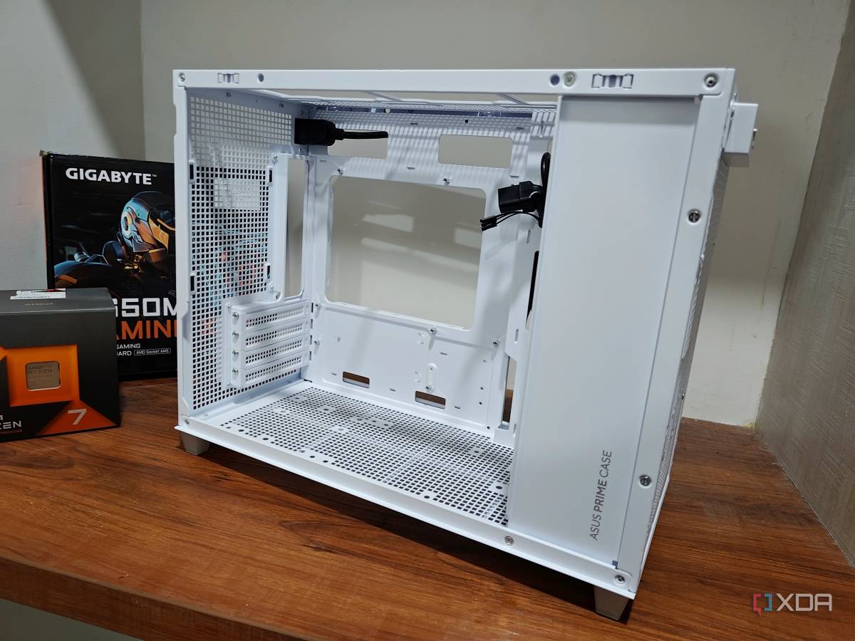 An image showing a disassembled Asus Prime AP201 case kept on a wooden table.