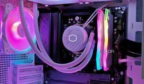 An image showing a white PC case with RGB-enabled components inside.