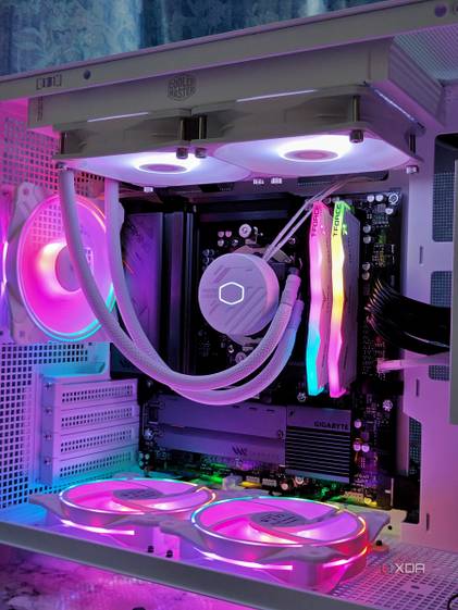An image showing a white PC case with RGB-enabled components inside.