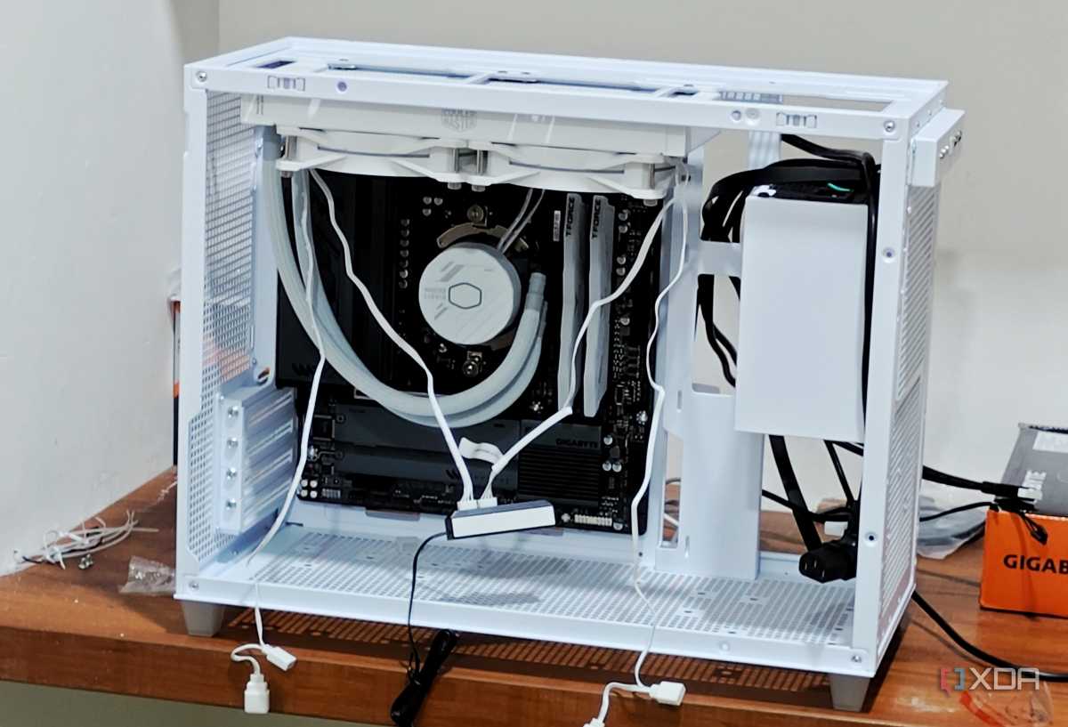An image showing a half-built PC featuring the Asus Prime AP201 case in white color.