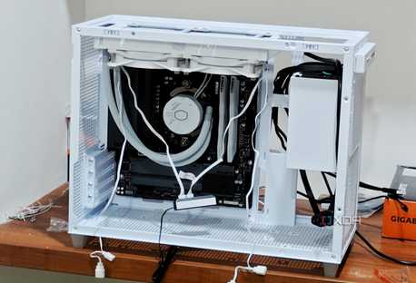 An image showing a half-built PC featuring the Asus Prime AP201 case in white color.