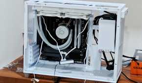 An image showing a half-built PC featuring the Asus Prime AP201 case in white color.