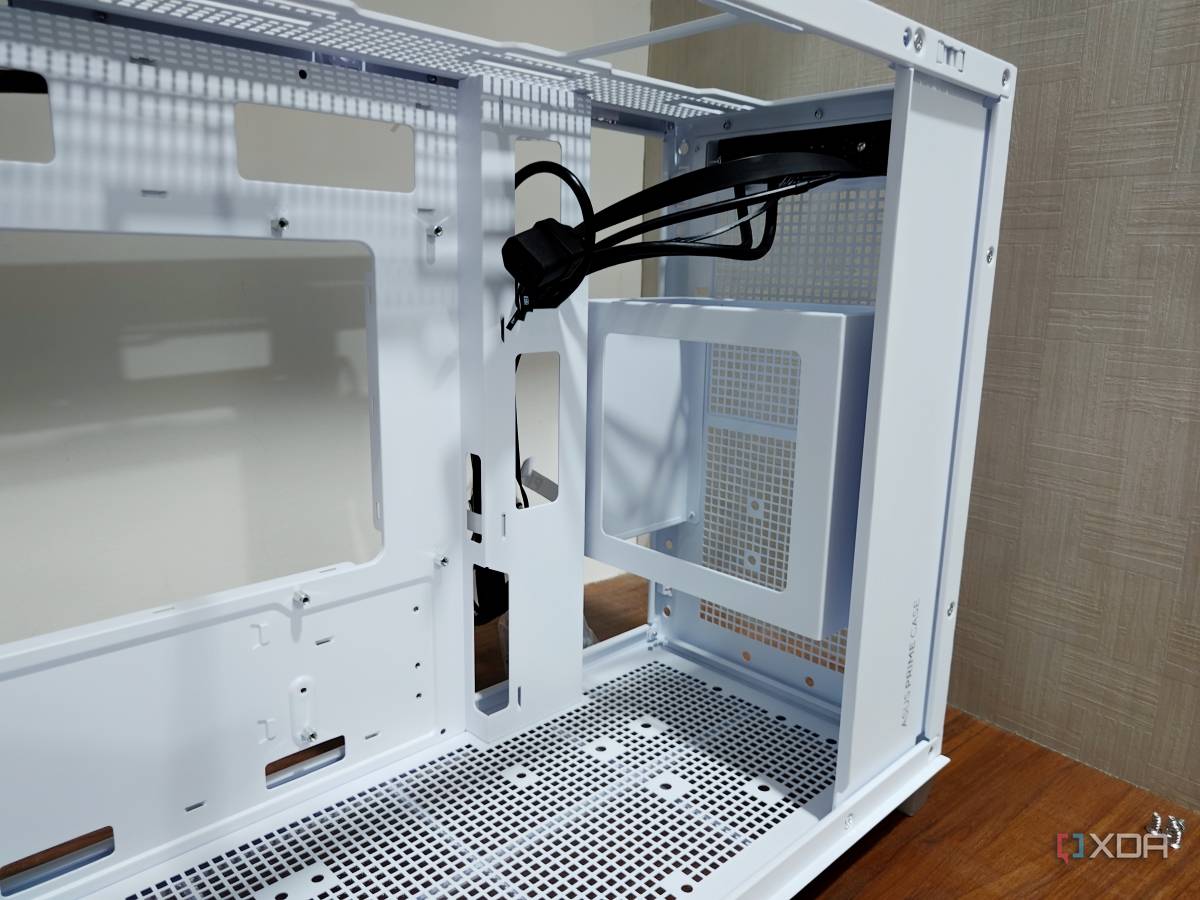 An image showing the front panel of a white-colored Asus Prime AP201 case.