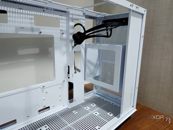 An image showing the front panel of a white-colored Asus Prime AP201 case.
