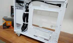 An image showing the motherboard side panel of a white-colored Asus Prime AP201 case.