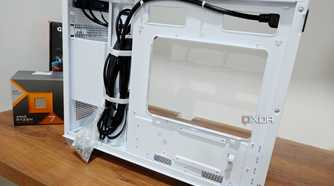 An image showing the motherboard side panel of a white-colored Asus Prime AP201 case.