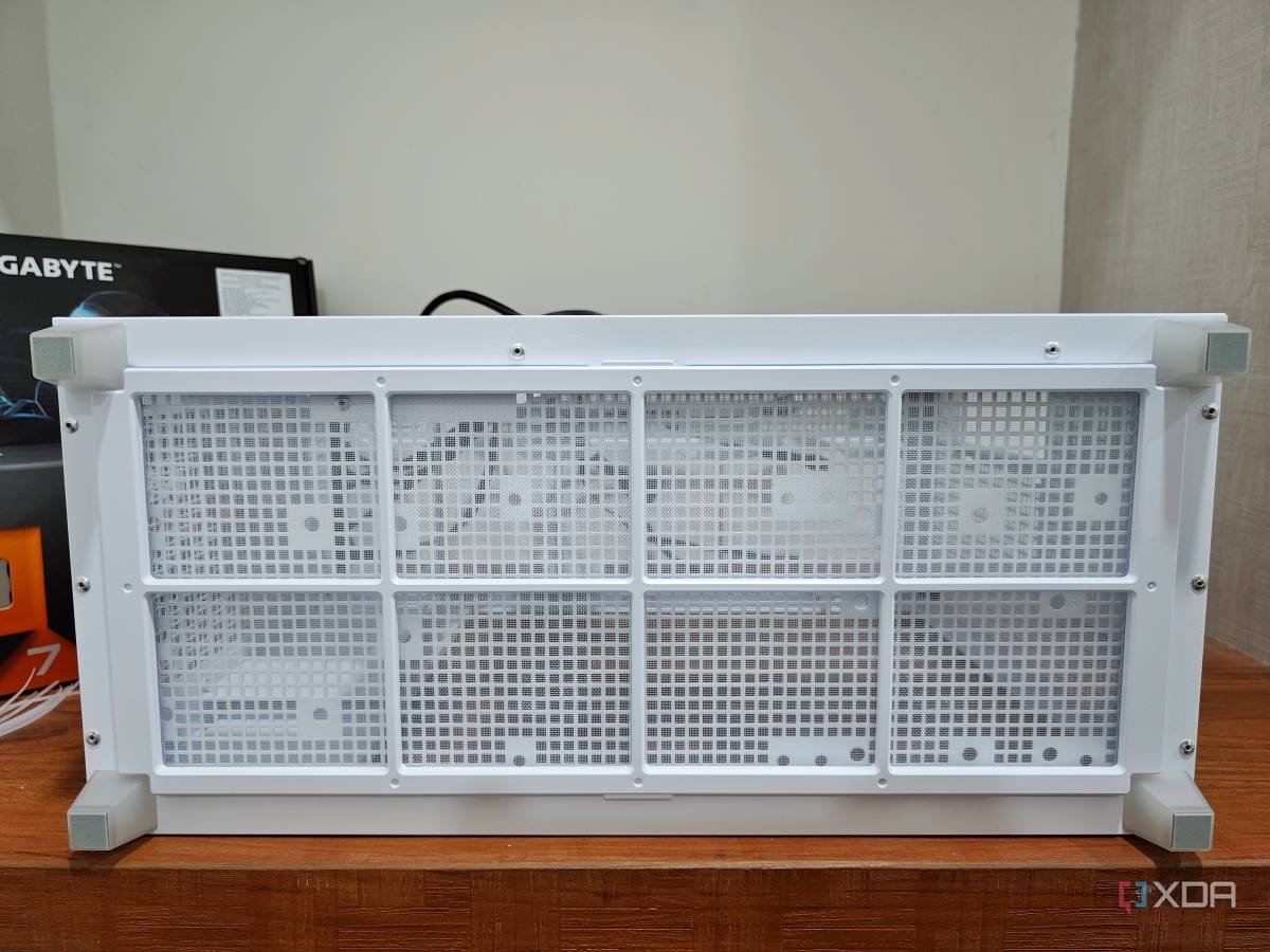 An image showing the bottom panel of a white-colored Asus Prime AP201 case.