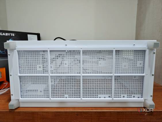 An image showing the bottom panel of a white-colored Asus Prime AP201 case.