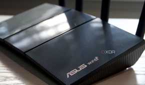 Asus RT-AX57 logo and Wi-Fi 6 marks on the router