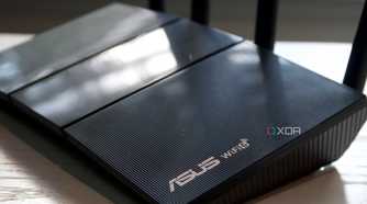 Asus RT-AX57 logo and Wi-Fi 6 marks on the router