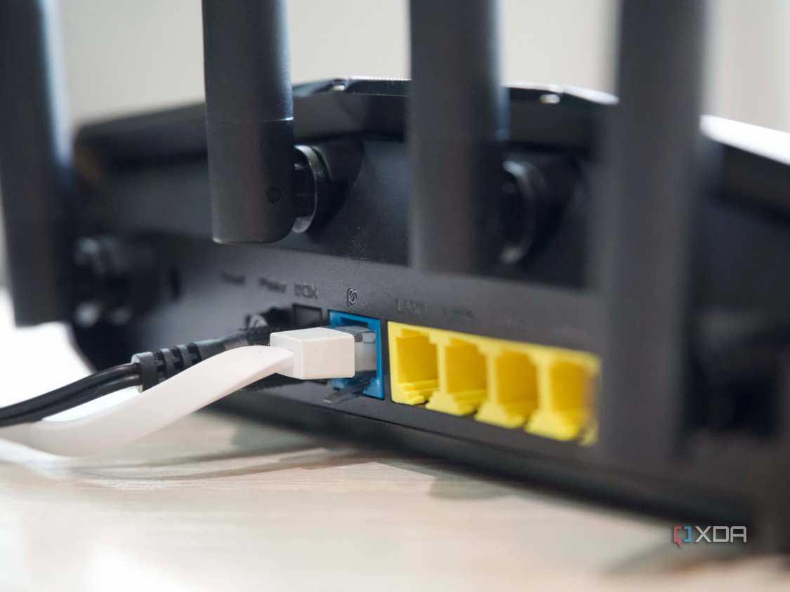 Asus RT-AX57 Ethernet ports and antennas from an angle