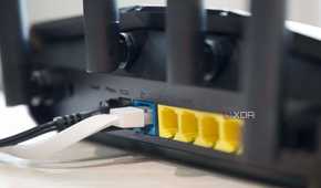 Asus RT-AX57 Ethernet ports and antennas from an angle
